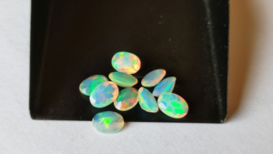 Ópalos blancos etíopes piedras preciosas ovaladas facetadas 6x4mm corte brillante redondo ópalo suelto Multi fuego Welo Opal cabujón lote al por mayor - Product Image 2