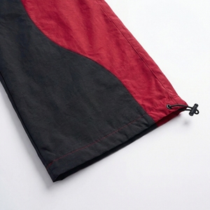 Pantalones Jogger Rojos y Negros al por Mayor, Pantalones Cortavientos de Nailon con Cremalleras Utilitarias, Proveedor OEM de Ropa Urbana y Deportiva - Product Image 2