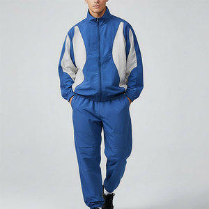 Conjunto Deportivo para Hombre, Chaqueta con Cierre y Cuello Alto, Pantalones Jogger, Color Azul con Bloques de Color, Secado Rápido, Ropa Deportiva - Product Image 1