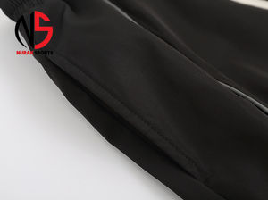 Pantalones reflectantes de nailon 2026, estilo holgado, de tela cortavientos para ropa urbana, pantalón de trabajo de seguridad, con sudadera desmontable y cortavientos ancho para mujer NURAK - Product Image 3