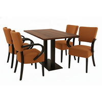 Ensemble de table à manger pour restaurant avec accoudoirs rembourrés, dessus de table en grain de bois et base en métal noir pour café et hôtel