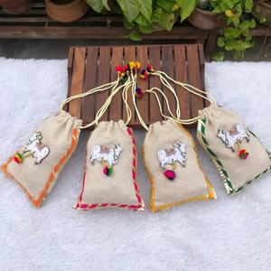 Handcrafted Jute <b>Potli</b> <b>Bags</b> with Traditional Kamdhenu Cow Motif: The Perfect Eco-Friendly Gift for Festive Occasions - Product Image 1