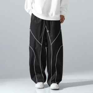 Pantalon de survêtement décontracté personnalisé, imperméable, blanc, coupe oversize, avec empiècements latéraux incurvés noirs, unisexe, pour hommes et femmes, directement de l'usine - Product Image 1