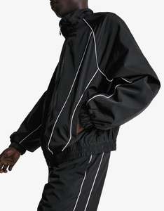 Ensemble de survêtement unisexe coupe-vent réfléchissant avec passepoil, veste et pantalon légers en polyester à fermeture éclair, vente en gros OEM - Product Image 2