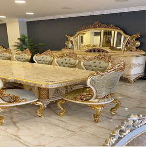 Luxurious 8-seater European <b>dining</b> table featuring polished beige marble top, ornate gold carved base and <b>chairs</b>, at wholesale. - Product Image 1
