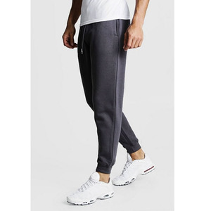Pantalon de survêtement bleu pour homme avec bandes latérales blanches et poches zippées, style décontracté urbain - Product Image 3