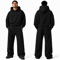 Ensemble survêtement streetwear haut de gamme en coton noir imprimé, comprenant un sweat à capuche oversize épais et un pantalon de survêtement large, personnalisable avec logo OEM