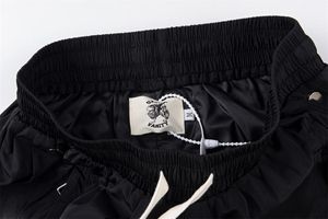 กางเกงแทร็คขายาวทรงหลวมสไตล์สตรีทแวร์สำหรับผู้ชาย กระดุมแป๊ก ผ้าไนลอน มีเชือกผูกเอว ปักลายปะติด รับผลิตแบบ OEM ขายส่ง - Product Image 3