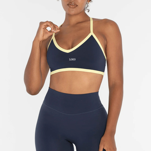 Soutien-gorge de sport pour femme, col en V, bretelles croisées, bordure contrastante, maintien moyen, vêtement de yoga respirant, couleur unie - Product Image 1
