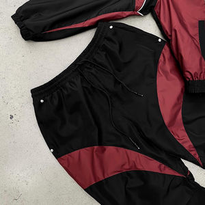 Conjunto deportivo de dos piezas para mujer, con bloques de color, cortavientos, pantalones jogger cortos de longitud completa, transpirable. - Product Image 2