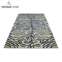 Tapis en laine tufté à la main de luxe à rayures tigrées exotiques, imprimé animal, noir et crème, écologique, adapté aux animaux domestiques