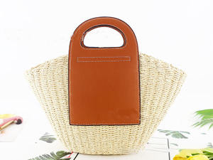Upgrade your daily accessory collection with this premium Natural yarn bag designed with a large leather patch and <b>top</b> handles - Product Image 4
