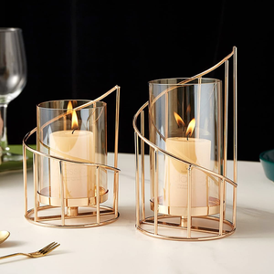 Fancy interlocking textured gold ring <b>candelabra</b> supporting three white spiral taper candles beautifully. Available at wholesale - Product Image 6