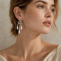 Boucles d'oreilles pendantes en alliage de zinc plaqué or, motif feuille creuse, fausses perles baroques, style vintage pour femme, vente en gros