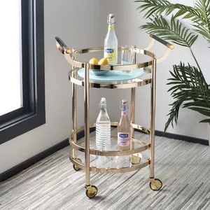 Chariot de bar rond en métal doré avec étagères en verre et roulettes pour le service de fête, style glamour, design durable - Product Image 1
