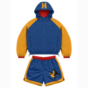 Conjunto de pantalones cortos cortavientos de poliéster de alta calidad, con paneles de color azul y dorado, logotipo personalizado con estampado térmico, conjunto de pantalones cortos cortavientos para hombre - Product Image 1