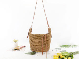 Discover the ultimate urban <b>accessory</b> with this stylish Natural yarn bag featuring a structured brown body and long shoulder - Product Image 1