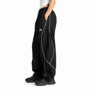 Pantalones de hombre a la moda, de alta calidad, con ribetes personalizados, logotipo bordado, holgados, impermeables, cortavientos, de poliéster, estilo baggy, de nailon, para deporte. - Product Image 2