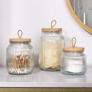 Frasco de vidrio con acabado liso y tapa de madera para un almacenamiento elegante y fácil limpieza, con vidrio resistente y tapa de madera. - Product Image 1