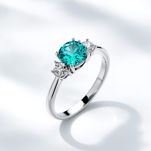 Anillo de Tres Piedras de Oro Blanco de 14K con Corte Redondo Color Paraiba, Fabricante de Joyería Fina Personalizada - Product Image 1