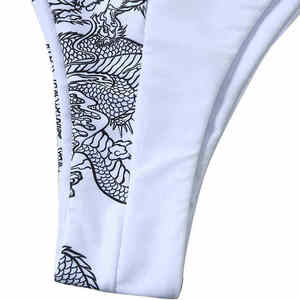 Conjunto de bikini triangular con cuello halter para mujer, parte inferior con lazo lateral, traje de baño con estampado de dragón blanco - Product Image 6