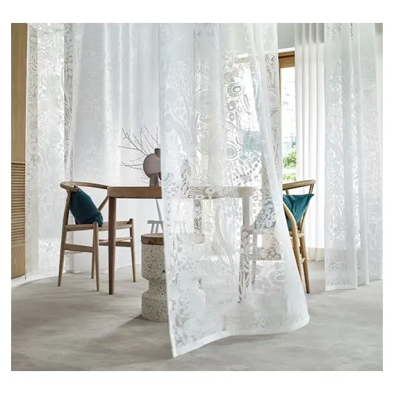 The delicate floral fabric curtain adds a touch of exhilaration to the living space.