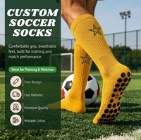 Chaussettes de football personnalisées à forte valeur ajoutée Chaussettes à prise en main d'usine Chaussettes antidérapantes