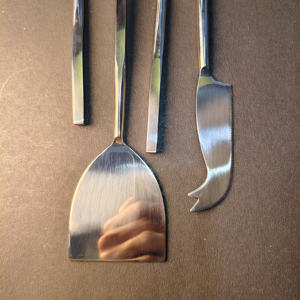 4-Piece Slim-<b>Handle</b> Artisan Cheese Set Pronged fork, heart-shaped knife, flat <b>shovel</b>, and spreader with slim, organic <b>handles</b>. - Product Image 4