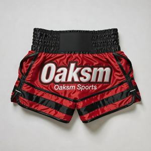 Pantalones Cortos de Muay Thai Personalizados en Satén Naranja y Negro con Logotipo Elástico OEM, Pantalones Cortos de Muay Thai Personalizados en Satén Naranja con Logotipo Bordado - Product Image 3