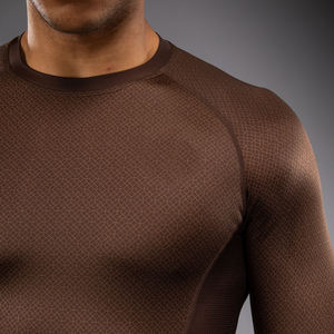 Tenue d'entraînement MMA de haute qualité pour l'extérieur, rashguard à manches longues pour le fitness, designs de logo personnalisés de haute qualité. - Product Image 1