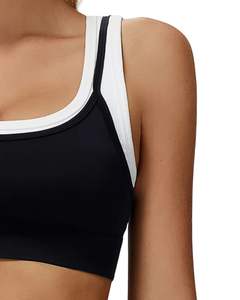 ชุดออกกำลังกายสำหรับผู้หญิง เสื้อชั้นในกีฬาไร้ตะเข็บและกางเกงขาสั้นเอวสูง สีดำขาว เนื้อผ้านุ่ม ยืดหยุ่น ระบายอากาศได้ดี เหมาะสำหรับออกกำลังกายและฟิตเนส - Product Image 4