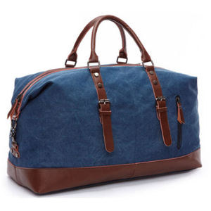 Blue Canvas Travel Duffel Bag With Brown Leather Trim And Adjustable Straps Fashionable Durability Feature - Product Image 1