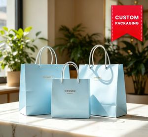 ถุงกระดาษสีขาว Vela พร้อมโลโก้สีทอง หูหิ้วแบบบิด ปรับแต่งการพิมพ์ได้ รีไซเคิลได้ ถุงแบบแบนมาตรฐาน สำหรับธุรกิจและการช้อปปิ้ง - Product Image 1