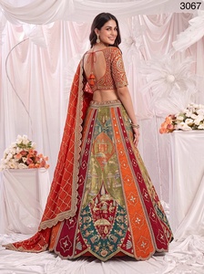 Ensemble de fête prêt-à-porter en soie Gadhwal de luxe, comprenant un Lehenga Choli orange de créateur, un imprimé de qualité supérieure et un travail de miroir et de Dori, avec chemisier cousu. - Product Image 5