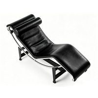 Chaise longue moderne en cuir noir avec appui-tête et structure métallique pour la maison, le bureau, le hall d'hôtel, le salon, la zone VIP
