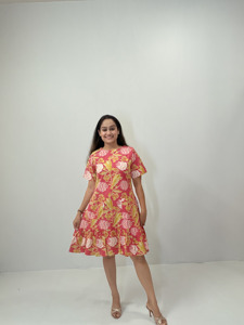 Women’s Pink Floral Print Casual Knee Length Dress with Short Sleeves Front Pockets and Ruffle Hem for Summer Wear - Product Image 1