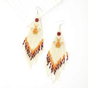 Pendientes de cuentas de arroz pequeñas de estilo étnico europeo y americano, con borlas largas de animales tejidas a mano. - Product Image 4