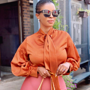Blusa de satén naranja para mujer con cuello de lazo y mangas abullonadas, elegante top de oficina, color sólido, para primavera/verano, estilo africano. - Product Image 1