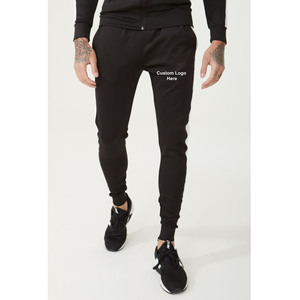 Pantalon de survêtement bleu pour homme avec bandes latérales blanches et poches zippées, style décontracté urbain - Product Image 1