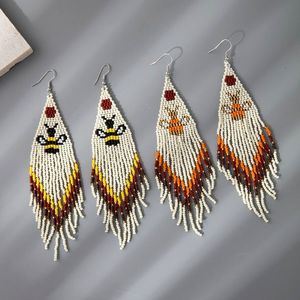 Pendientes de cuentas de arroz pequeñas de estilo étnico europeo y americano, con borlas largas de animales tejidas a mano. - Product Image 6
