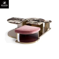 Un fabricant chinois a conçu une nouvelle table basse moderne de luxe sur mesure avec un plateau en marbre et un cadre en métal pour le salon