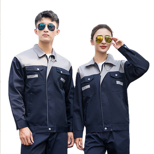 Combinaison de travail unisexe bleu foncé avec bordure orange, bretelles réglables, plusieurs poches, usage industriel, polyester, certifiée CE, personnalisable - Product Image 1