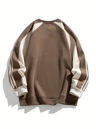 Classic crewneck pullover featuring a unique multi-tone construction with deep brown, cream, and black accents. - Product Image 3