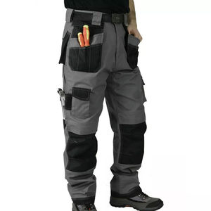 Heavy duty workwear pants for men with reinforced <b>knees</b> and utility pockets for construction and industrial use - Product Image 1