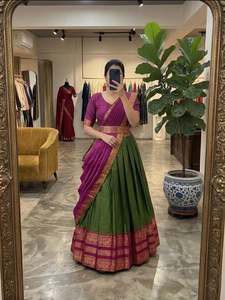 Conjunto de lehenga de algodón y seda exquisitamente elaborado con un llamativo contraste de tonos de joyas ricos y adornos dorados Zari. - Product Image 1