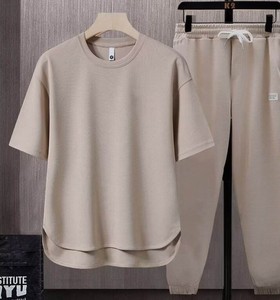 Ensemble deux pièces décontracté pour homme, couleur unie, t-shirt à col rond à manches courtes, pantalon long en tricot respirant, vêtements d'été - Product Image 5