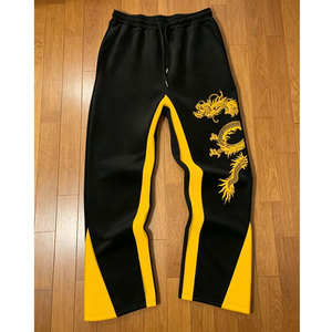 Pantalon de jogging décontracté pour homme, noir et jaune, broderie dragon, taille élastique avec cordon de serrage, en polyester mi-lourd, idéal pour l'automne - Product Image 1