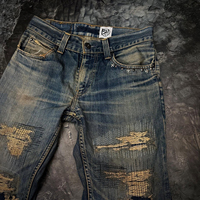 Jeans Denim Berkualitas Tinggi Bahan Katun Spandex Bernapas Model Distressed Pria Logo Kustom Warna Dicuci