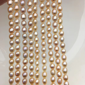 Perles d'eau douce ovales rose pêche AAA 5-5,5 mm, haute brillance, naturelles, cultivées, en vrac pour la fabrication de bijoux - Product Image 1