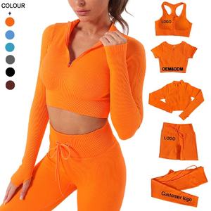 Conjunto Deportivo de Cuatro Piezas para Mujer, Color Naranja, Bra Deportivo Elástico, Top Corto, Top de Manga Larga con Cierre y Pantalones Cortos Ajustados - Product Image 1